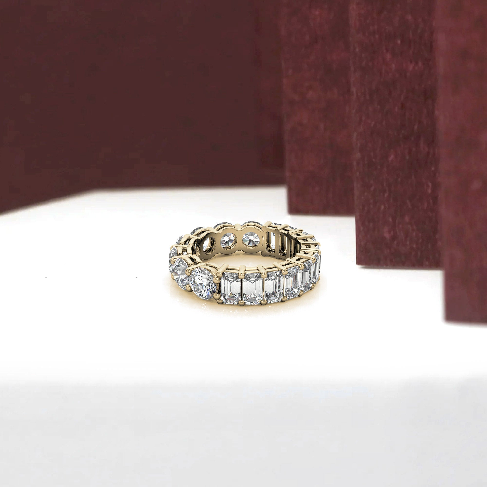 Sterling Silver Elegant Shimmering Round And Emerald Cut Diamonds Yellow Gold Eternity Band For Women